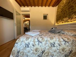 Ένα ή περισσότερα κρεβάτια σε δωμάτιο στο CASA DI ELENA