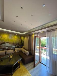 a living room with a bed and a couch at Holiday Home Zelena Oaza in Sarajevo +40 photos