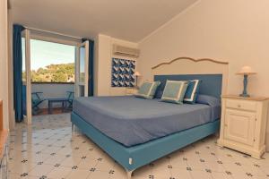 Postel nebo postele na pokoji v ubytování Hotel Garden Riviera