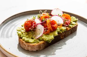 a piece of bread with guacamole on a plate at The Westin Houston Medical Center - Museum District in Houston
