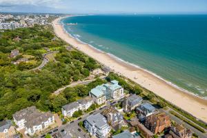 an aerial view of a beach with condos at Middle Chine in Bournemouth