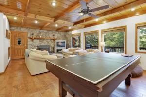 a living room with a pool table at 2321-Knickerbocker Retreat chalet in Big Bear Lake