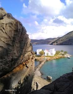 a view of a body of water from a cliff at Symi . VILLA CALME (Sur la Mer). in Symi