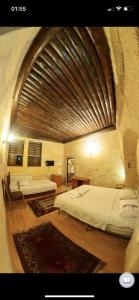 Postel nebo postele na pokoji v ubytování Monastery cave Hotel Cappadocia