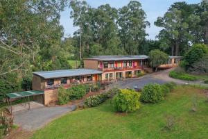 an aerial view of a house with a yard at Treetops Silvan Valley Lodge - suite 1 in Silvan