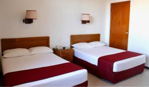 Postel nebo postele na pokoji v ubytování Hotel Calvete