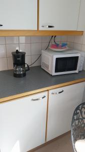 Η κουζίνα ή μικρή κουζίνα στο Cozy Aparti +3 φωτογραφίες