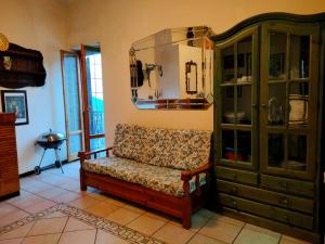 a living room with a couch and a cabinet at Casa Anversa in Anversa degli Abruzzi