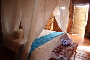 Postel nebo postele na pokoji v ubytování Infinito Tatacoa