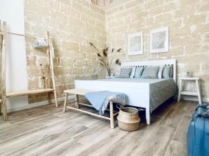 Ένα ή περισσότερα κρεβάτια σε δωμάτιο στο Wanderlust Beach Apartment