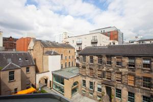 an aerial view of a city with buildings at 1 Bedroom Flat in the Heart of Merchant City in Glasgow