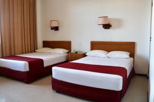 Postel nebo postele na pokoji v ubytování Hotel Calvete + 14 fotografií