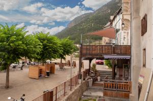 a street in a town with a mountain at Panorama apartment Briancon in Briançon