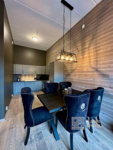 a dining room with a table and chairs at New high standard apartment in Trysil alpine lodge in Trysil