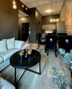 a living room with a couch and a table at New high standard apartment in Trysil alpine lodge in Trysil