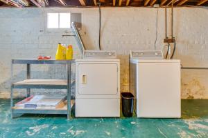 two refrigerators and a table in a room at Charming Springfield Home 2 Mi to Downtown in Springfield