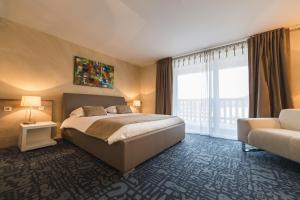 Postel nebo postele na pokoji v ubytování Hôtel Le Dormeur