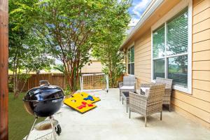 a backyard with a grill and chairs and a playground at Cibolo Sa Getaway Wi-fi Bbq Games Parking in Cibolo
