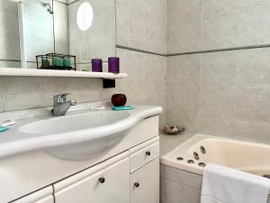 a bathroom with a sink and a bath tub at Great Apartment in Recoleta in Buenos Aires