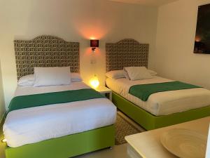 Cama o camas de una habitación en Hotel RioMiel Tlaxcala