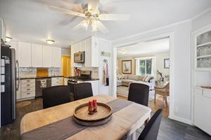 a kitchen and dining room with a table and chairs at Charming Pet Friendly Coastal Getaway home in Fort Bragg