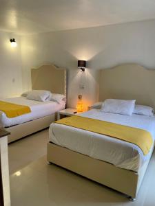 Cama o camas de una habitación en Hotel RioMiel Tlaxcala