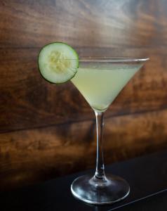 a drink with a cucumber in a glass at Baton Rouge Marriott in Baton Rouge