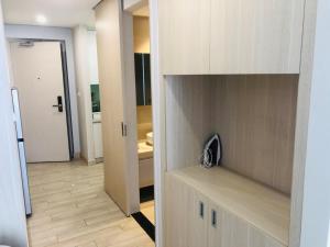 a room with a kitchen with a door to a room at Luxury studio apartment near Nha Trang beach in Nha Trang