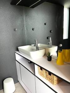 a bathroom with a sink and a toilet at KODA Concrete villa by the river with sea view in Papsaare