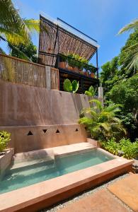 a small swimming pool on the side of a house at Punta Navi - Adults only - Boutique hotel in Puerto Escondido