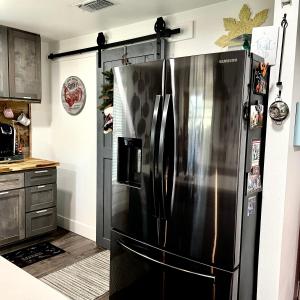 a kitchen with a stainless steel refrigerator at Pet Friendly Graham 2 Bedroom Home Christmas 365 at The Mistletoe Farm in Graham