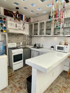 Una cocina o zona de cocina en Hotel RioMiel Tlaxcala