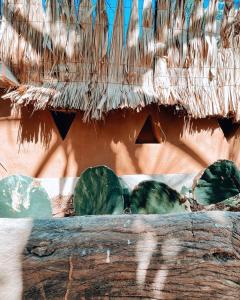 a close up of a thatched roof with plants at Punta Navi - Adults only - Boutique hotel in Puerto Escondido