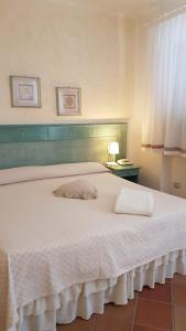 Ein Bett oder Betten in einem Zimmer der Unterkunft Hotel Gallo Nero