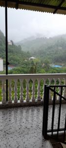 a white balcony with a view of a valley at guest hause giorgi,kobuleti- xala in Itʼkhvisi