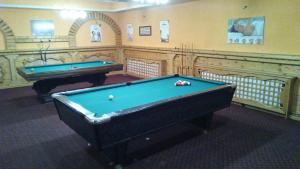 a billiard room with two pool tables in it at Lovac in Štrpce