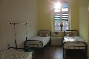 Posteľ alebo postele v izbe v ubytovaní Hostel Centrum Sabot