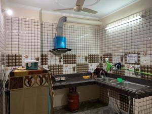 a kitchen with a sink and a counter top at $4 HOME STAY (5 MINT WALK FROM GOLDEN TEMPLE) in Amritsar