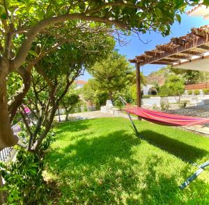 A garden outside Villa Naya by the Beach