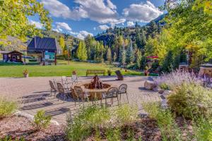 a patio with a table and chairs in a park at Seasons Lodge #202 in Edwards