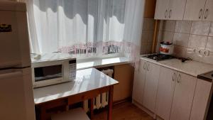Kuchyň nebo kuchyňský kout v ubytování Квартира посуточно в Sillamäe!