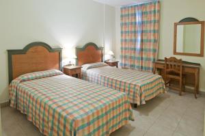 Postel nebo postele na pokoji v ubytování Apartamentos Las Mozas + 17 fotografií