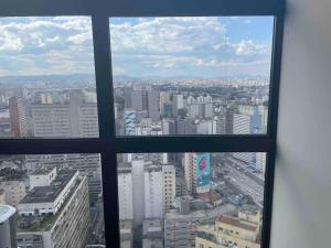 a view of a city from a window at Sky Loft - Andar 41 in Sao Paulo