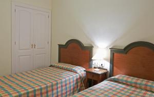 Postel nebo postele na pokoji v ubytování Apartamentos Las Mozas