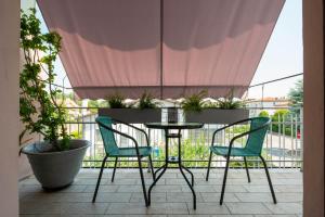 A balcony or terrace at Officine Cavour - Appartamenti la Quercia