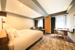 Postel nebo postele na pokoji v ubytování Richmond Hotel Narita