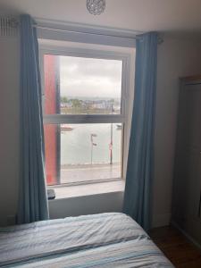 Voodi või voodid majutusasutuse Appartment with sea view toas