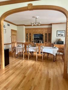 a large dining room with a table and chairs at The Inn at Woodsong Acres in Conneaut