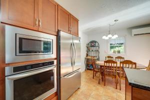 a kitchen with a stainless steel refrigerator and a dining room at Secluded Canton Vacation Rental 22 Mi to Asheville in Canton