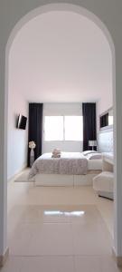 Postel nebo postele na pokoji v ubytování Balcon Roque del Conde